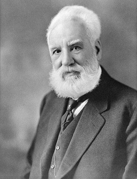 Alexander Graham Bell looking at the camera for a black and white portrait.