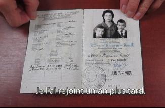 An old passport is opened to the photo page.